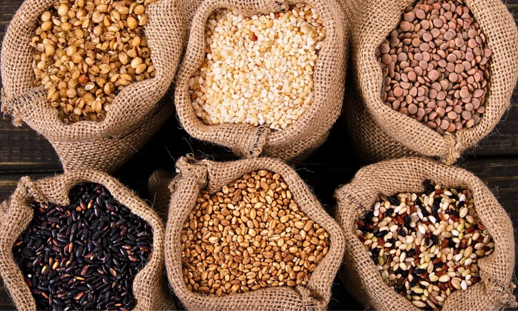 Mediterranean Diet for Depression assorted whole grains and legumes in burlap sacks including lentils, brown rice, wild rice, barley, bulgur, and millet