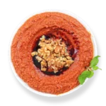 Muhammara dip from Aladdin Mediterranean Cuisine—roasted red pepper & walnut spread drizzled with olive oil.