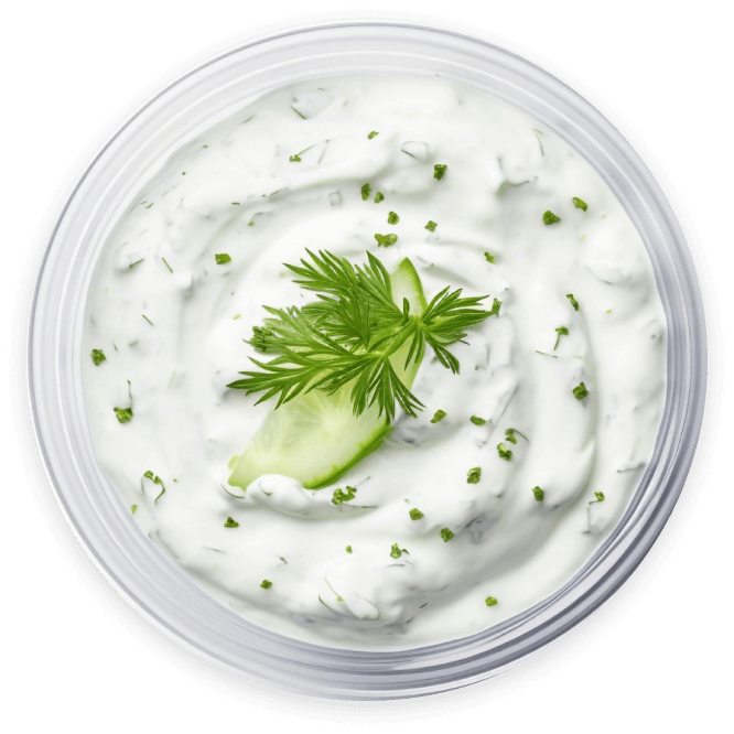 Tzatziki Dip with fresh dill in a white bowl