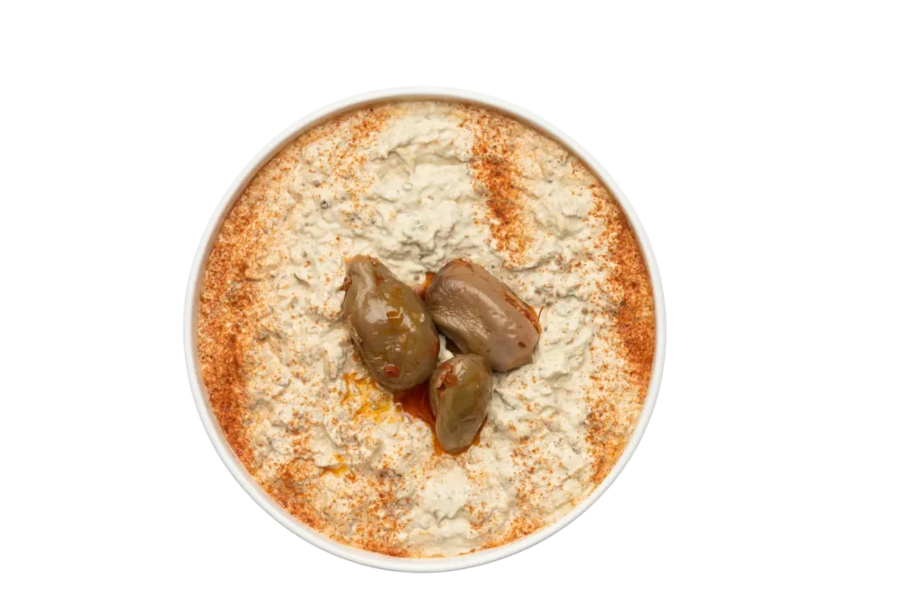 a bowl of Baba Ghanouj with a black background