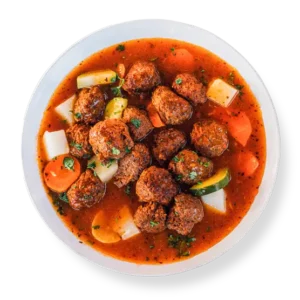 Gluten-free spicy lamb meatballs in smoky chipotle gravy, plated at Aladdins Houston