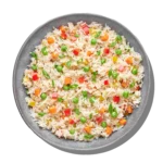 Vegetable rice colorful rice blended with carrots, peas, bell peppers, and Mediterranean herbs at Aladdin Houston