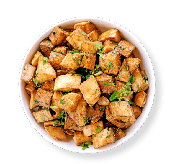 Lemon cilantro potatoes in a white bowl and no background a perfect Lunch near me spot Aladdins houston