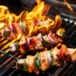 Mediterranean chicken kabob halal Houston — char-grilled skewer with peppers and onions on open flame