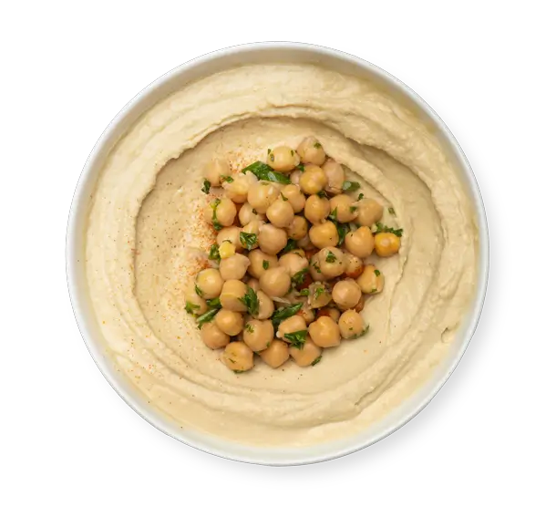 Traditional hummus topped with chickpeas, tahini, and olive oil – Aladdin Mediterranean Cuisine Houston