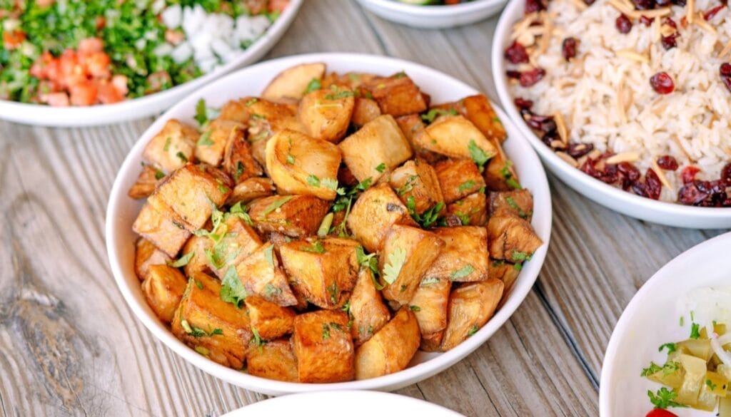 Deliciously roasted golden potatoes dish at Aladdin Montrose.